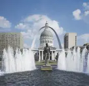 A fountain in front of the st. Louis arch